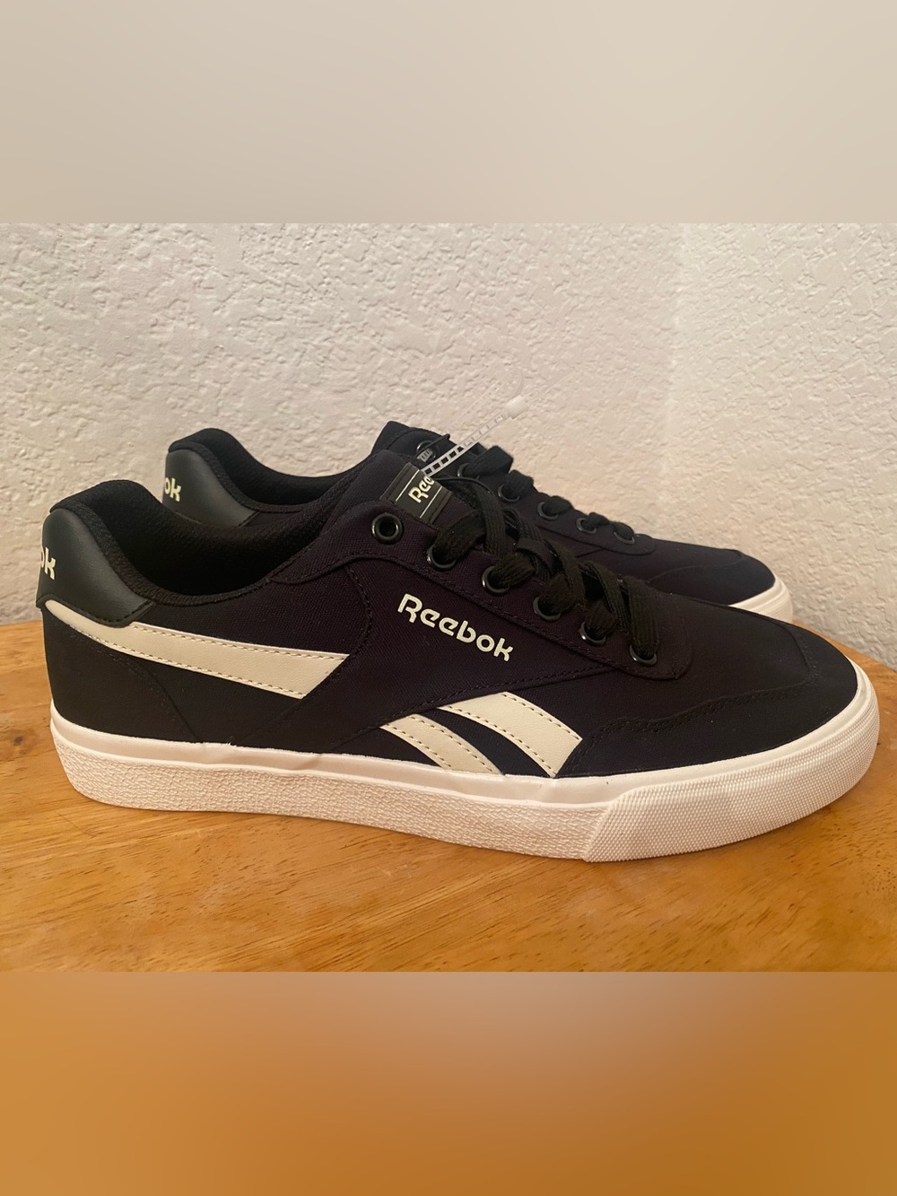 Reebok Black Sneakers with White Side Stripes